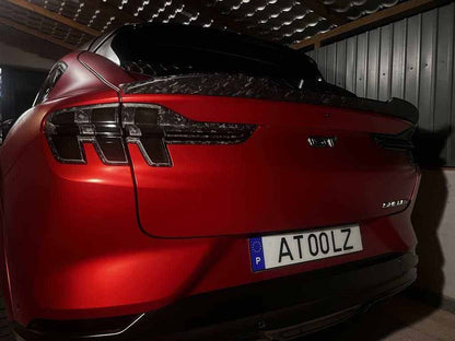 Rear view of red Mustang Mach-E with black Spoiler V2 for Mustang Mach-E installed