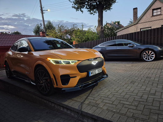 Mustang Mach-E GT with ULTIMATE front pony grille parked outdoors at dusk