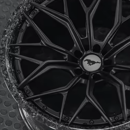 Custom forged Al6061-T6 aluminum wheel for Mustang Mach-E with Mustang emblem, sleek black design, and precision craftsmanship
