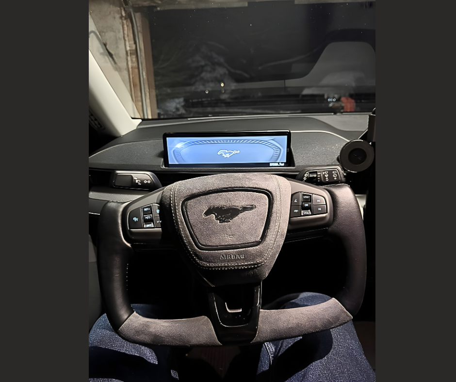 Ford OEM Yoke steering wheel with Mustang logo and integrated controls for Mach-E vehicles
