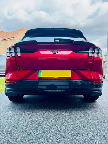 Rear view of red Mustang Mach-E with Spoiler V2 installed